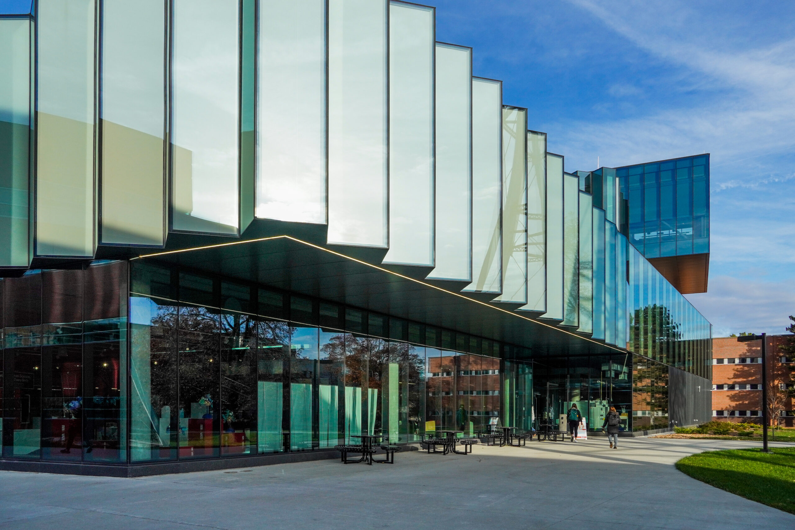 An image of a bright, sunny day outside the Student Innovation Center, showcasing its modern architecture and vibrant surroundings.