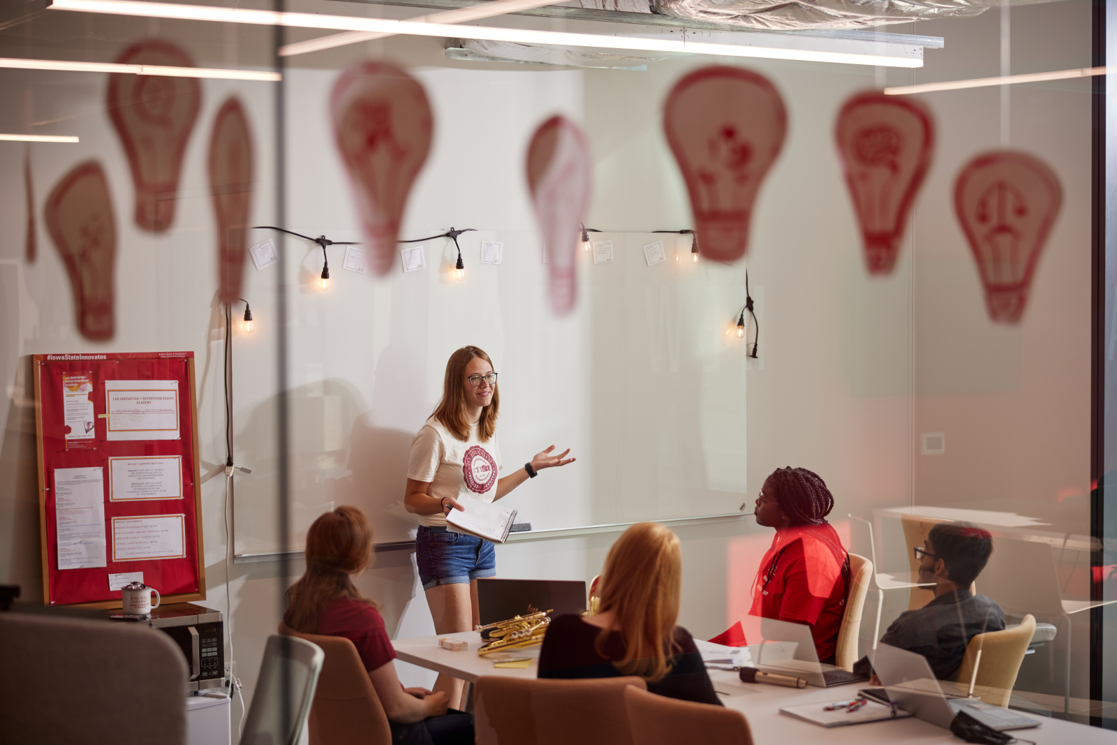 Image of a building partner presenting during a team meeting.